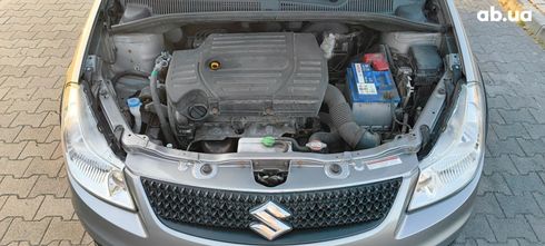 Suzuki SX4 2011 серебристый - фото 13