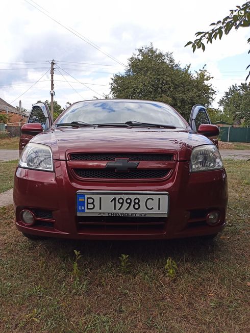 Chevrolet Aveo 2008 вишневый - фото 9