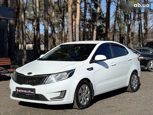 Kia Rio 2012 - фото 8