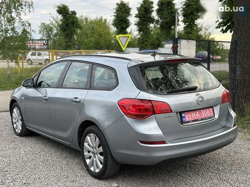 Opel Astra 2010 - фото 16